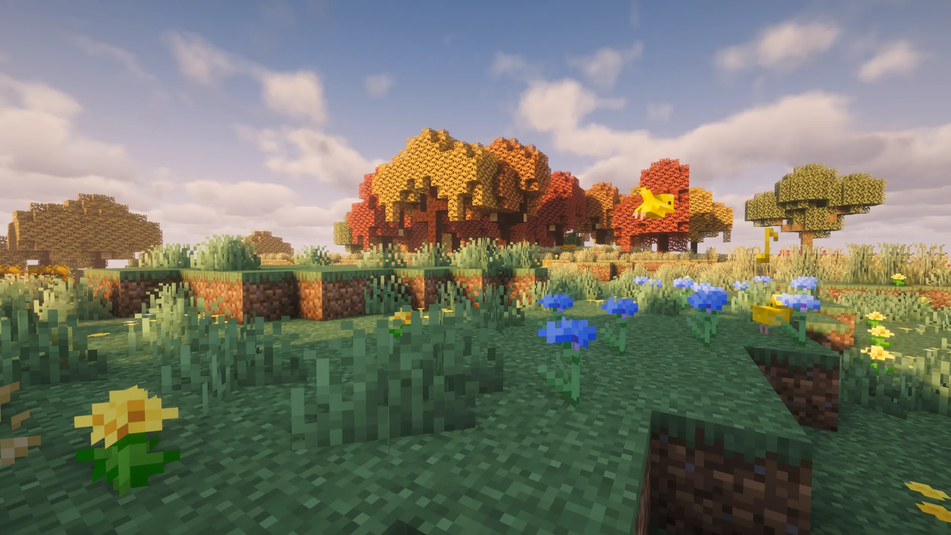 A bright modded Minecraft meadow with autumn trees and wildflowers